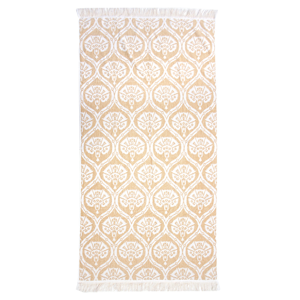 Luxurious Tamarindo Beach Towel in durable Egyptian cotton with velour finish, oversized design, and stylish natural fringing.