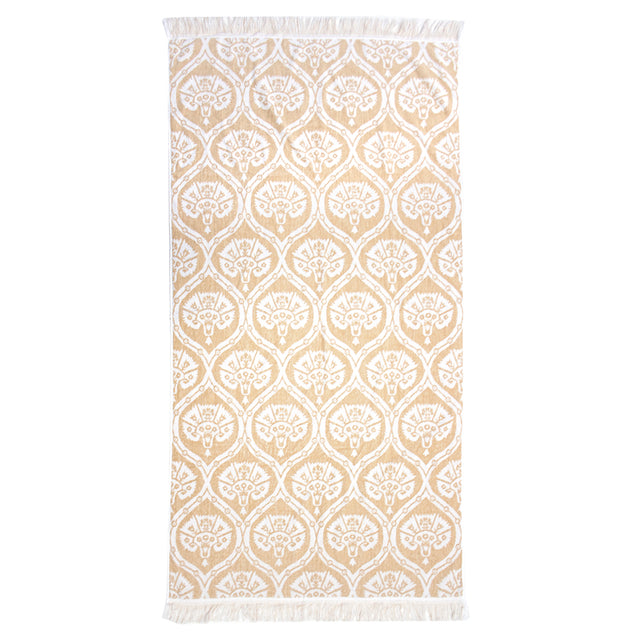 Luxurious Tamarindo Beach Towel in durable Egyptian cotton with velour finish, oversized design, and stylish natural fringing.