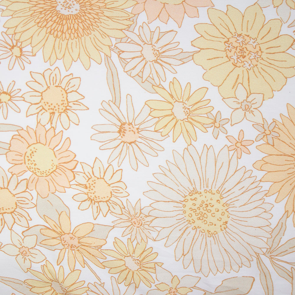 Vibrant 70s retro floral duvet cover set featuring cheerful daisies and sunflowers, includes quilt cover and two pillowcases.