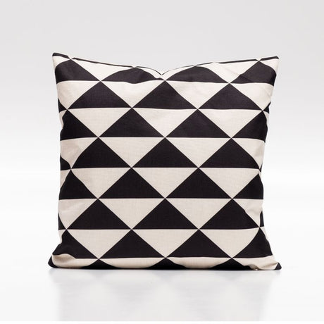 Black and white square cushion cover with a geometric triangular pattern, perfect for modern home decor.