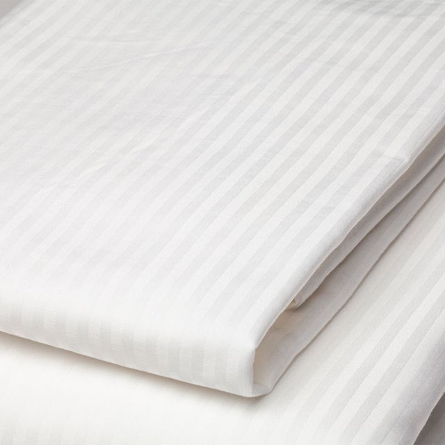 Luxurious 4mm sateen stripe flat sheet for king single beds, crafted from a soft 50/50 polycotton blend with 312 thread count.