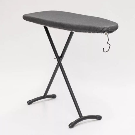 Compact black ironing board with hook, adjustable height, non-slip legs, and detachable iron holder, ideal for effortless storage.