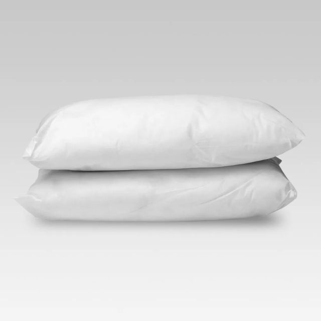 Lightweight, medium loft pillow made from 15 recycled bottles, offering hypoallergenic comfort for travel or home use.