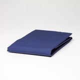 Fitted sheet in elegant navy, crafted from 50% cotton and 50% polyester, offering comfort, durability, and wrinkle-free care.