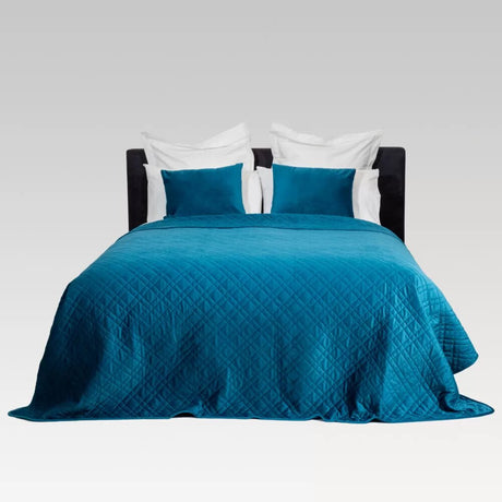 Luxurious teal quilted coverlet in Holland Velvet, perfect for year-round styling and easy maintenance.