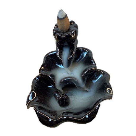 Black ceramic backflow incense burner with waterfall smoke effect, perfect for meditation and home decor.