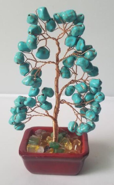 Handcrafted 15cm turquoise howlite gemstone tree, promoting tranquility and enhancing home decor with natural beauty.