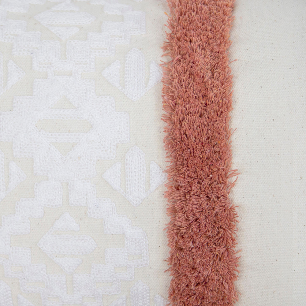 Sedona Rectangle Cushion in Clay with geometric embroidery and tufting, perfect for cozy decor on couch or bed.