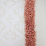 Sedona Rectangle Cushion in Clay with geometric embroidery and tufting, perfect for cozy decor on couch or bed.
