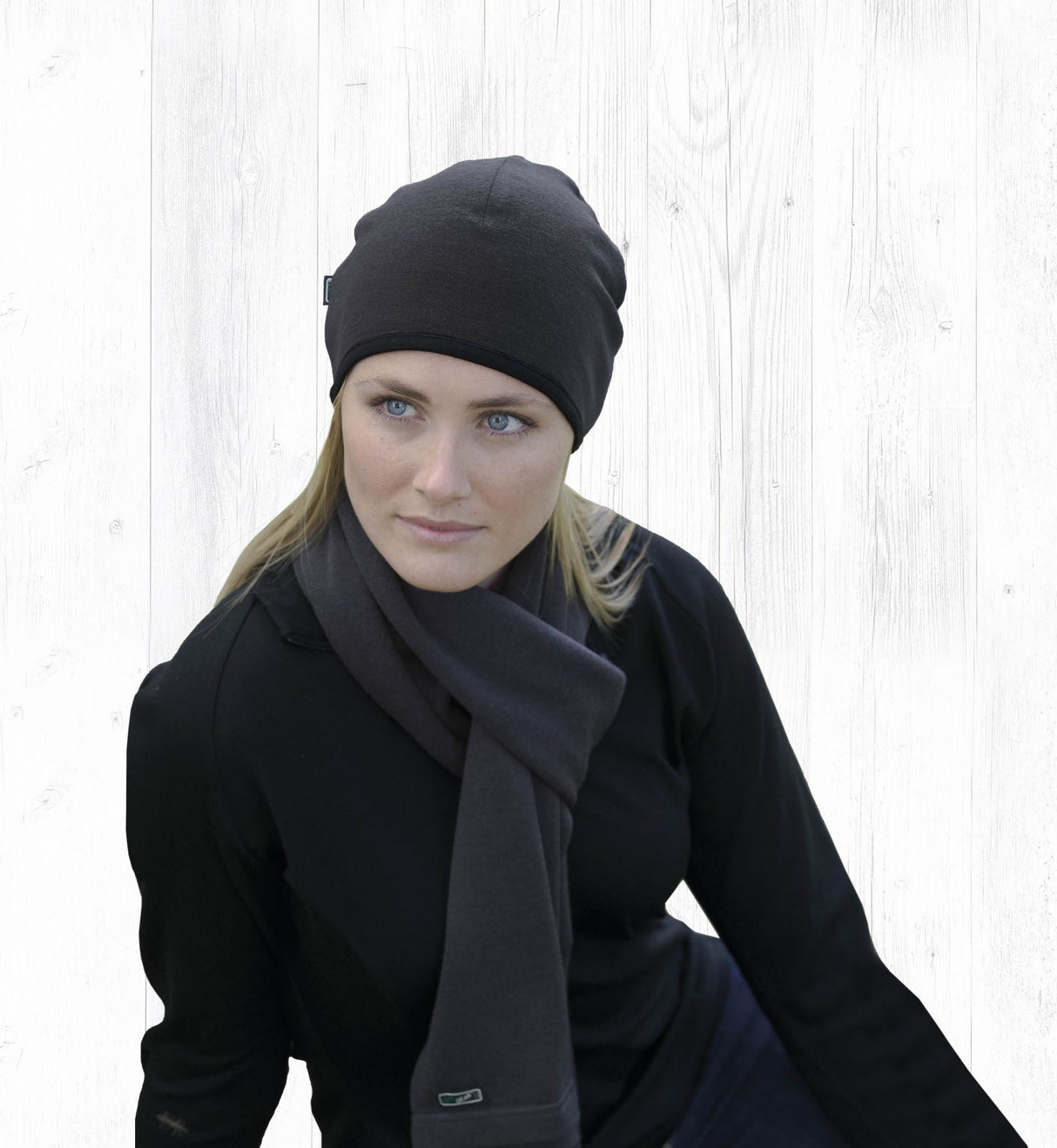 Sleek black Merino Arctic Scarf in 100% wool, eco-friendly, 176cm long, perfect for warmth and style in winter.
