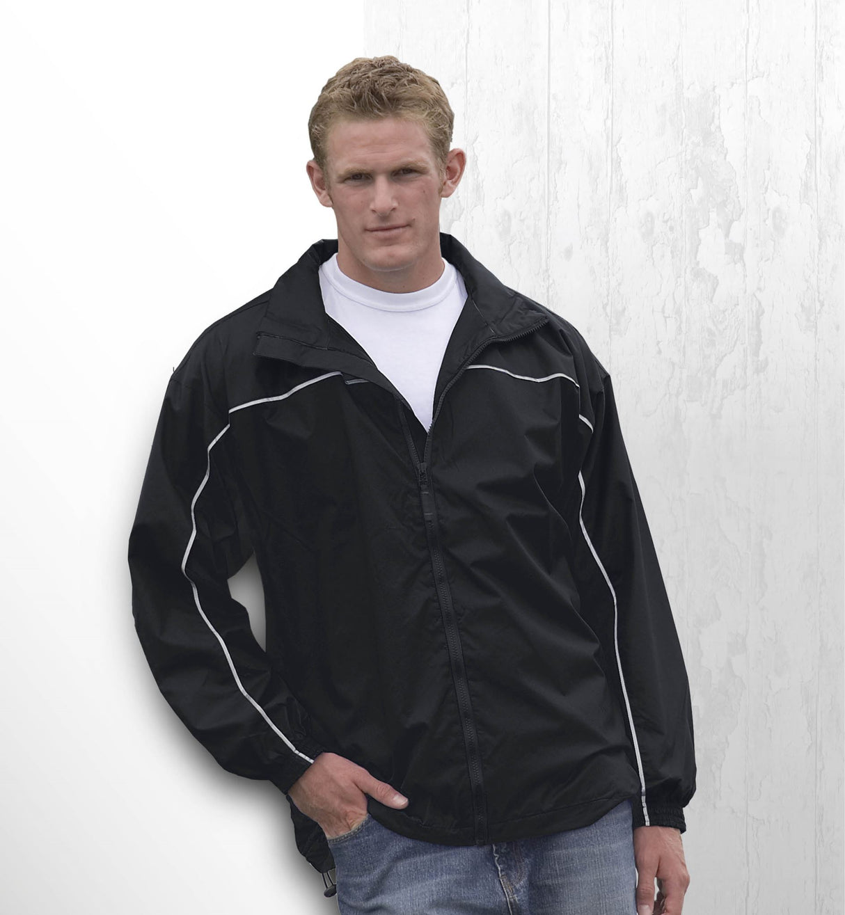 Lightweight nylon ripstop jacket with showerproof finish, reflective details, and hidden hood for outdoor adventures.