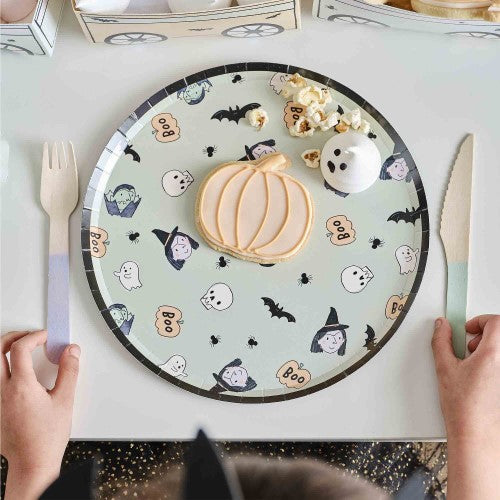 Set of 8 Halloween paper plates featuring whimsical vampire and witch designs, perfect for parties and eco-friendly festivities.