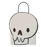 Skull-shaped Halloween paper party bags, eco-friendly, perfect for trick-or-treating or festive gatherings.