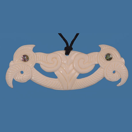 Bone Pekapeka Pendant featuring intricate carvings of intertwined bat forms, symbolizing light and love, on a black adjustable cord.