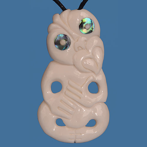 Bone Tiki Pendant handcrafted from high-quality bone, symbolizing heritage and protection, on a black adjustable cord.