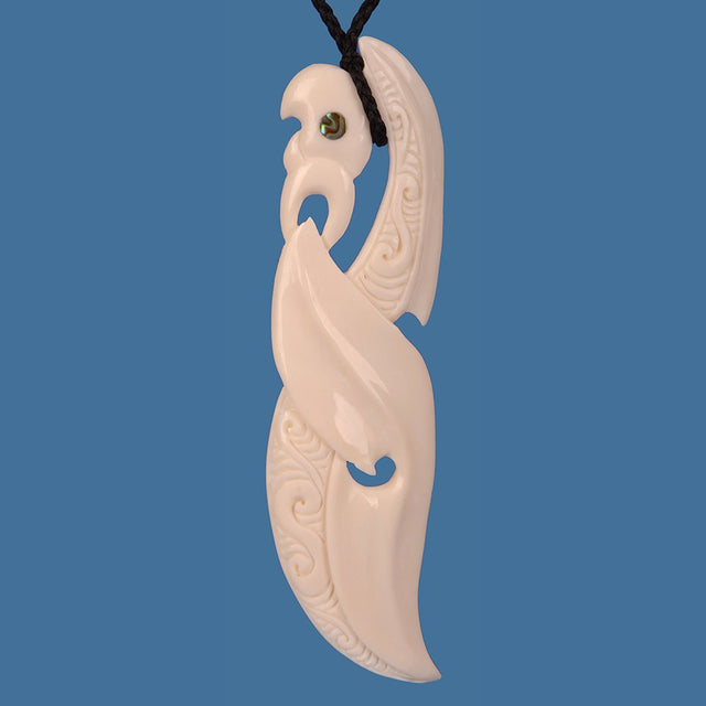 Extra large handcrafted Bone Manaia pendant, showcasing intricate Maori carvings and symbolizing protection and heritage.