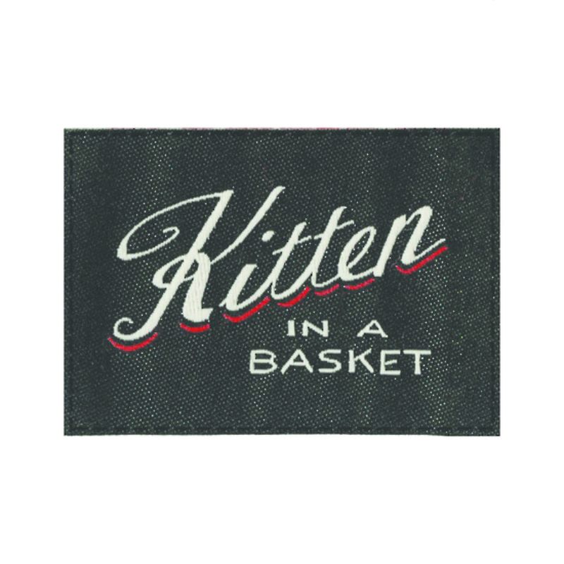 Blue Q Tag Socks featuring a whimsical 'Kitten In A Basket' design, offering comfort for women's size 9-13 and men's size 8-12.