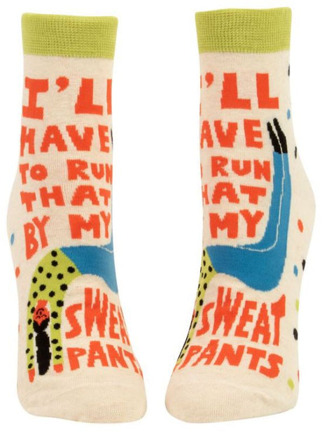 Blue Q ankle socks featuring a humorous phrase, designed for comfort and style, perfect for lounging or casual outings.