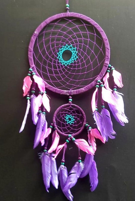 Purple 22cm dreamcatcher featuring intricate beadwork, designed to enhance decor and promote positive energy.