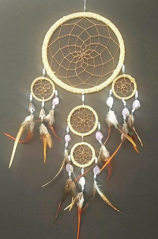 Handcrafted 5-hoop dreamcatcher in natural cotton, 16cm diameter, promotes tranquility and enhances home decor.