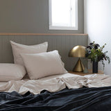 Luxurious single sheet set in pebble, made from organic cotton, vintage-washed for softness, eco-friendly and stylish.