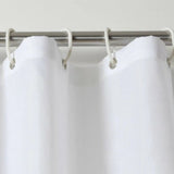 Plain white shower curtain made of durable polyester, measuring 120W x 180cmH, ideal for stylish bathroom decor.