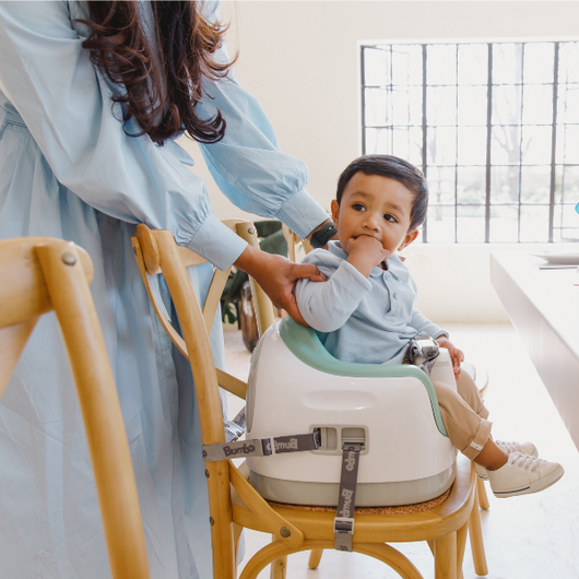 Versatile Multi Seat - Bumbo in Hemlock, suitable for infants 6 months to 3 years, with adjustable height and removable tray.