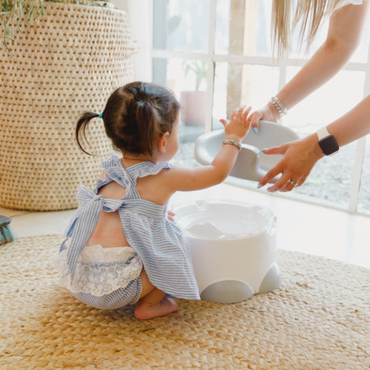 Bumbo Step n' Potty in Cool Grey: versatile potty trainer with slip-resistant seat, easy clean design, and sturdy step stool.