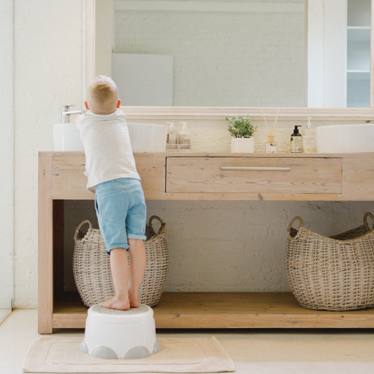 Bumbo Step n Potty in Cradle Pink: a versatile potty and step stool for toddlers, ensuring safety and comfort during training.