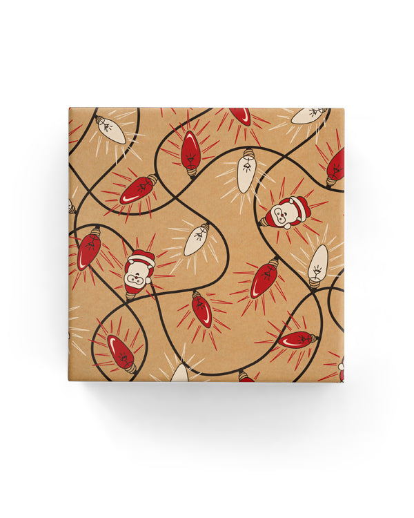 Wrapping paper roll featuring festive Xmas lights on a black, red, and white Kraft background, 600mm x 40m.