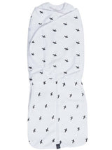Black criss-cross baby swaddle made of 100% cotton, featuring a double wrap system and easy-access double-ended zip.