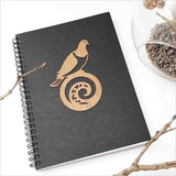 Kiwiana Black Journal featuring a Kereru and koru design, perfect for creative writing and artistic expression.