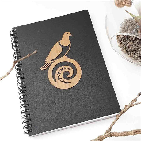 Kiwiana Black Journal featuring a Kereru and koru design, perfect for creative writing and artistic expression.