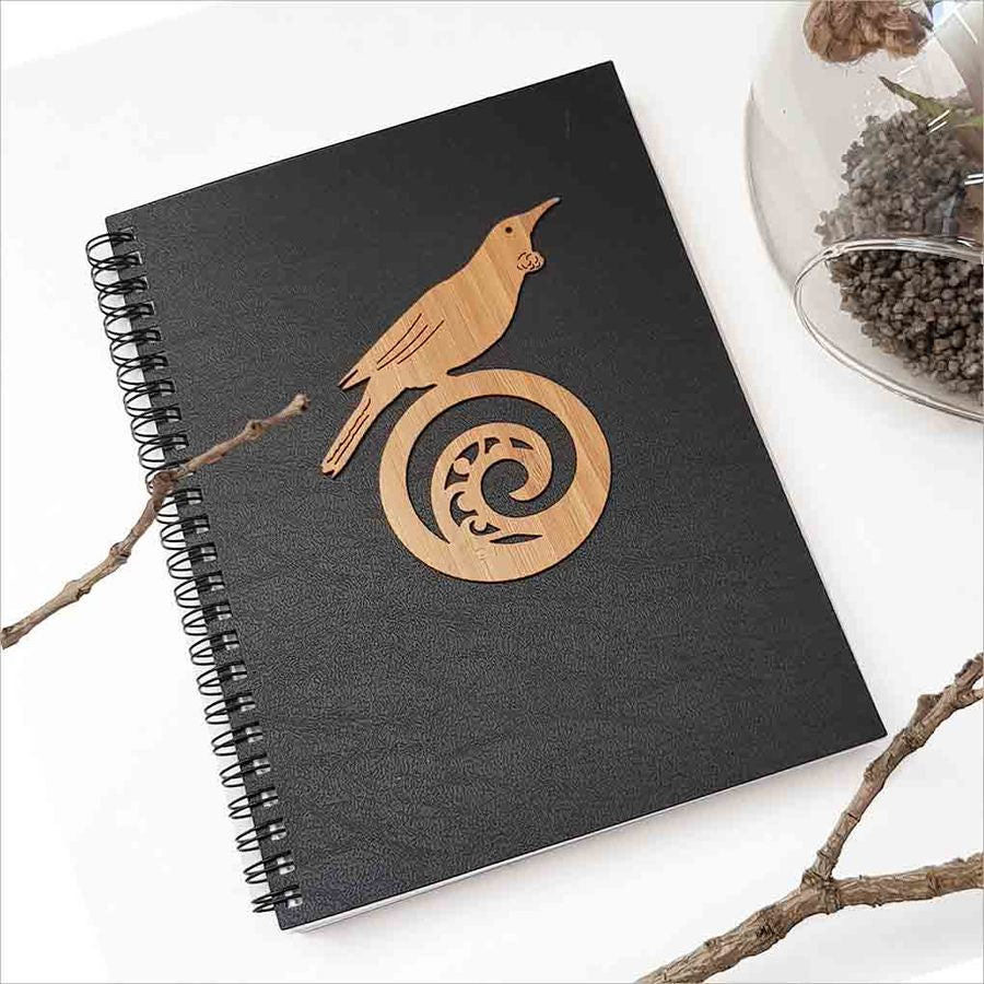 Kiwiana Black Journal featuring a Tui bird on Koru design, perfect for capturing thoughts and creativity in an A5 size.
