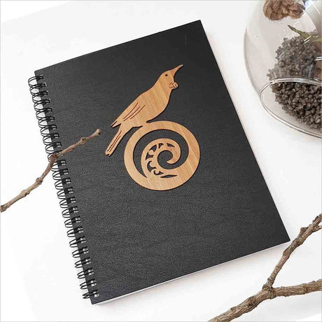 Kiwiana Black Journal featuring a Tui bird on Koru design, perfect for capturing thoughts and creativity in an A5 size.