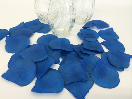 Blue silk rose petals in bulk (864 petals) designed for elegant decor, centerpieces, and crafts at special occasions.