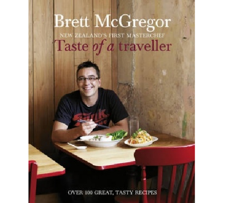 Cookbook 'Taste of a Traveller' by Brett McGregor featuring vibrant recipes inspired by global culinary travels.
