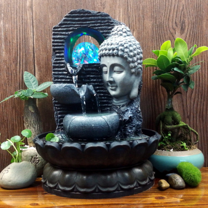 Tranquil 3 Tier Buddha Face Water Feature with multi-colored lights, perfect for indoor or outdoor relaxation, 20x20x27cm.