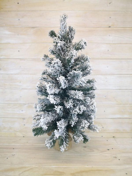 24-inch artificial snowy pine tree with burlap base, perfect for winter decorations and holiday ambiance.