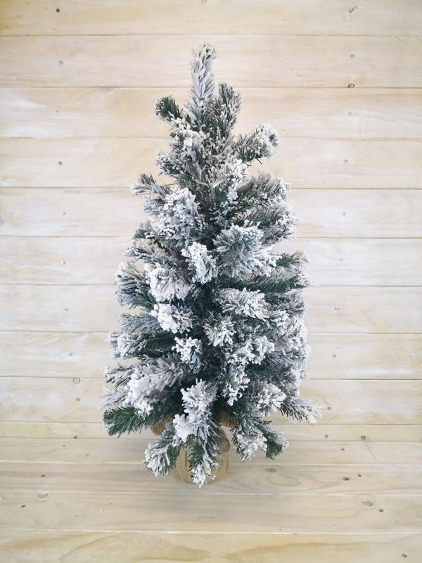 24-inch artificial snowy pine tree with burlap base, perfect for winter decorations and holiday ambiance.