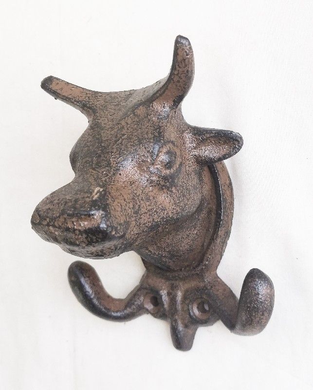 Decorative bull head wall hook with 2 durable hooks, perfect for organizing coats and bags in small spaces.