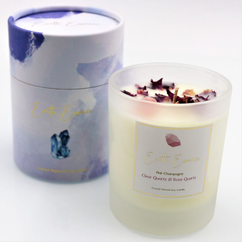 Soy wax candle in crystal pink champagne with Rose Quartz, Clear Quartz, and dried rose petals; 40-hour burn time.