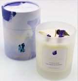 Soy wax candle featuring lavender and vanilla scents, adorned with Amethyst, Clear Quartz, and dried Forget-Me-Not flowers.
