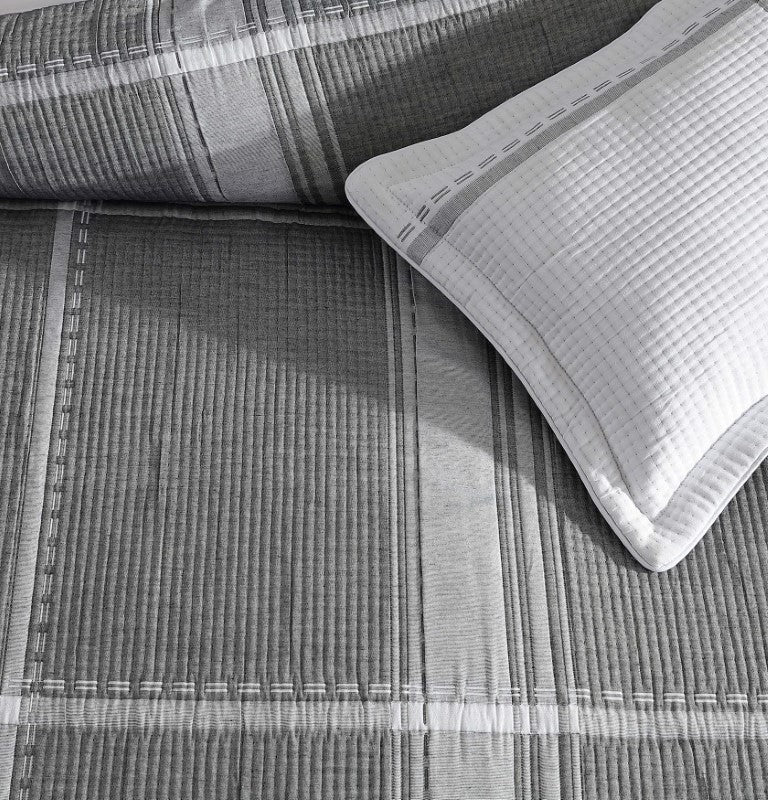 Super King duvet cover set in charcoal with subtle check pattern, includes pillowcases, blending luxury and durability.