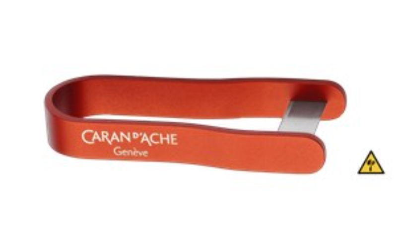 Caran D'ache C-D Pencil Sharpening Blade in red, featuring ergonomic design and versatile sharpening techniques for artists.