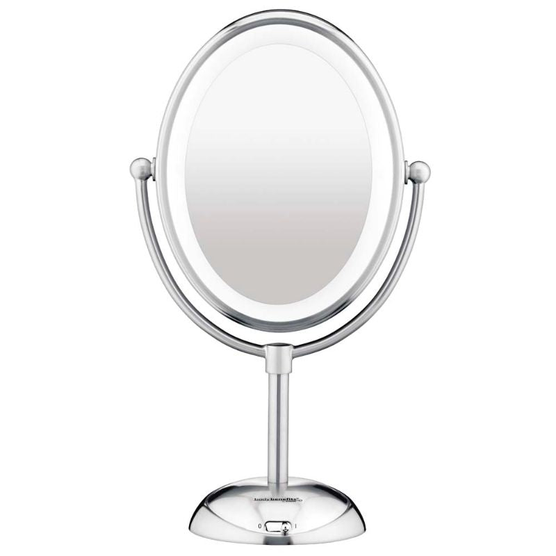 Oval LED lighted mirror with polished chrome finish, 7X magnification, and adjustable brightness for flawless beauty routines.