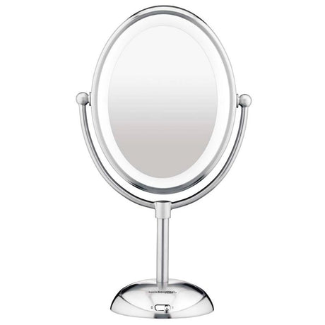 Oval LED lighted mirror with polished chrome finish, 7X magnification, and adjustable brightness for flawless beauty routines.