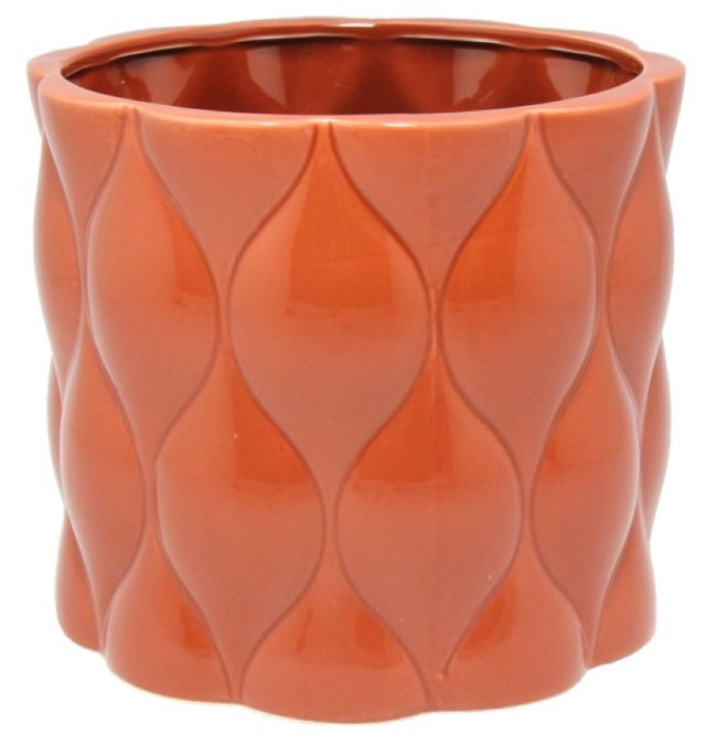 Round ceramic pot in rust with an intricate diamond pattern, perfect for showcasing succulents or flowers.