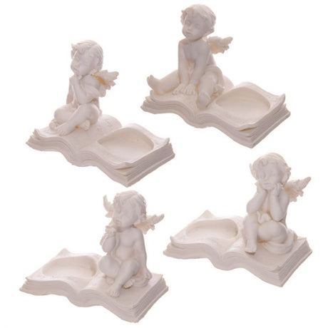 Set of 4 detailed cherub candle holders on books, adding whimsical charm and elegance to any home decor.