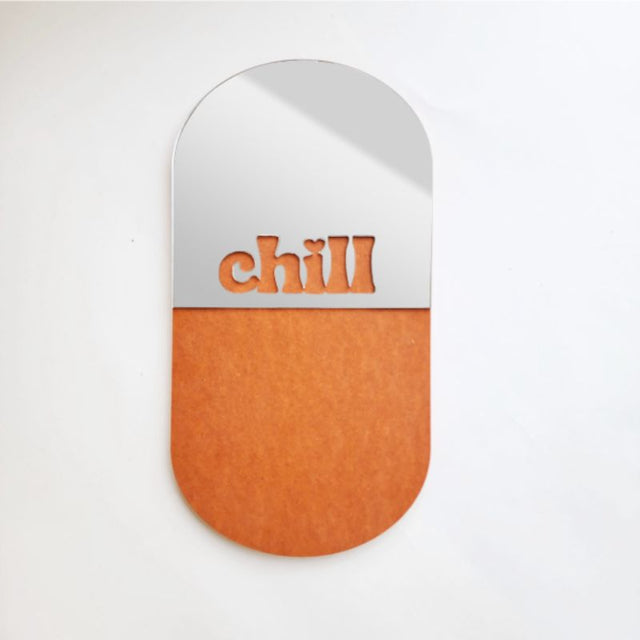 Stylish Chill Pill Orange mirror crafted from eco-friendly Valchromat, featuring a lightweight design and durable acrylic mirror.